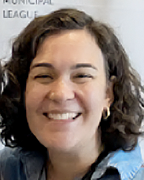 image of Heather Stauffer, white women between 20-23 smiling with chin length curling brown hair